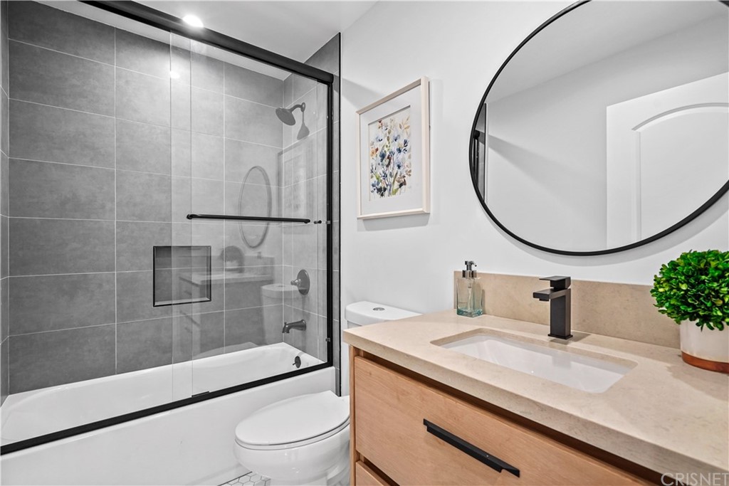 3675 Denair Street Pasadena, CA 91107 - Photo 18 of 37 a bathroom with a sink a toilet and a mirror