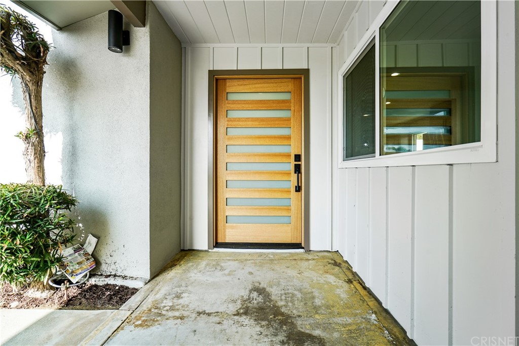 3675 Denair Street Pasadena, CA 91107 - Photo 3 of 37 a view of a room that has a window and brick walls
