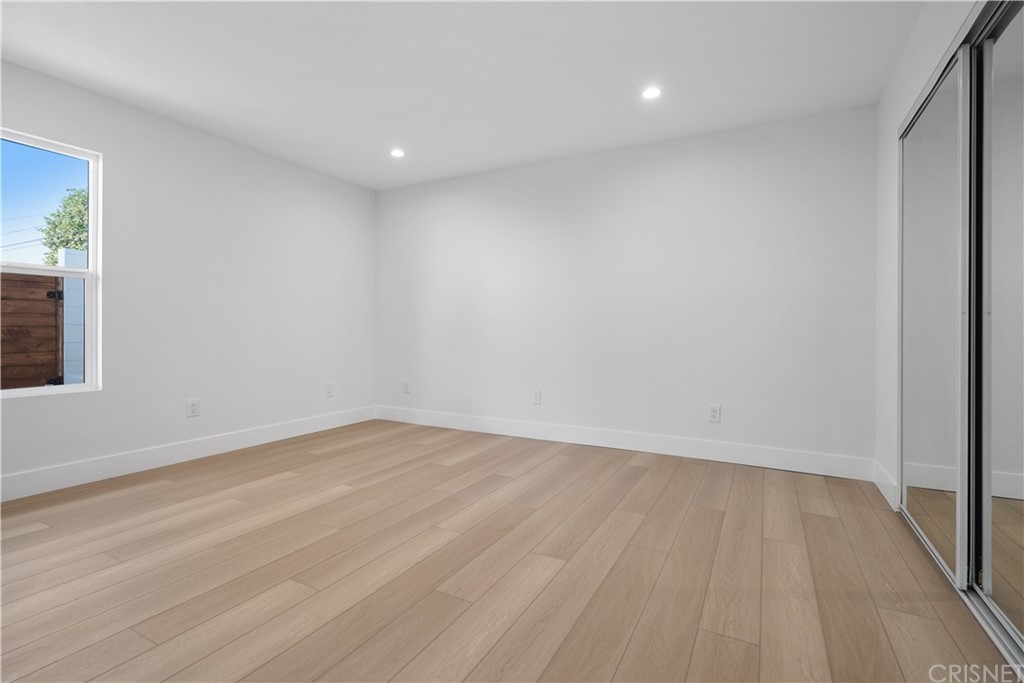3675 Denair Street Pasadena, CA 91107 - Photo 23 of 37 a view of an empty room with wooden floor and a window