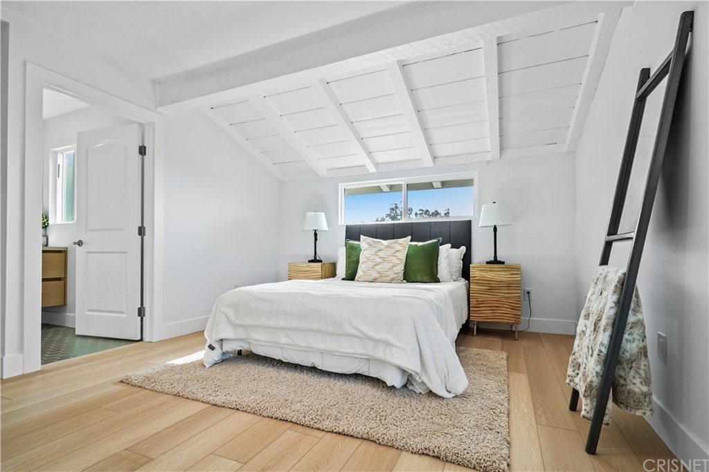 3675 Denair Street Pasadena, CA 91107 - Photo 26 of 37 a bedroom with a bed and a large mirror