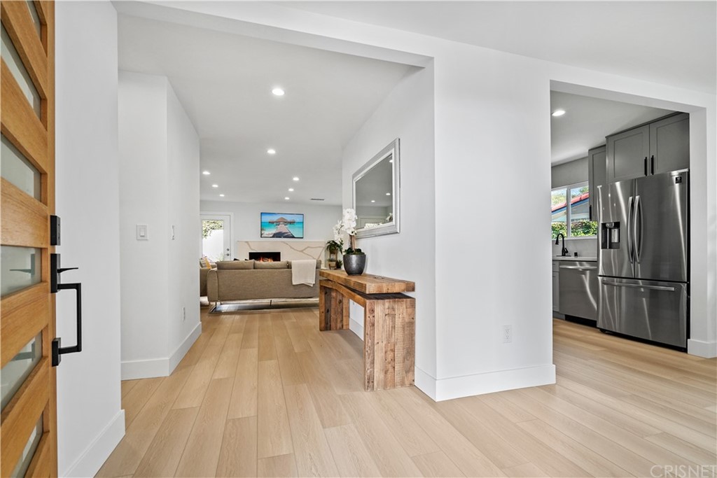 3675 Denair Street Pasadena, CA 91107 - Photo 4 of 37 a view of a living room kitchen with stainless steel appliances furniture a refrigerator and a stove top oven