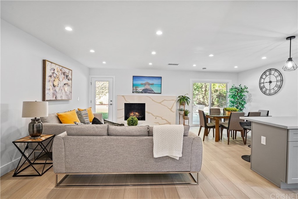 3675 Denair Street Pasadena, CA 91107 - Photo 5 of 37 a living room with furniture a fireplace and a table