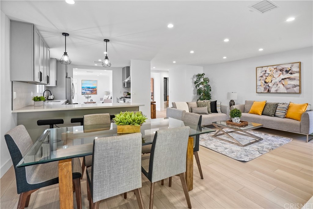 3675 Denair Street Pasadena, CA 91107 - Photo 8 of 37 a living room with stainless steel appliances kitchen island granite countertop furniture and a wooden floor
