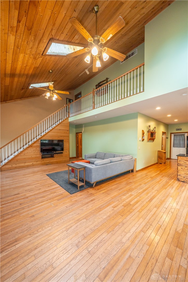 10584 New Biddinger Road Harrison, OH 45030 - Photo 12 of 61 This expansive living area features a grand staircase and abundant natural light.