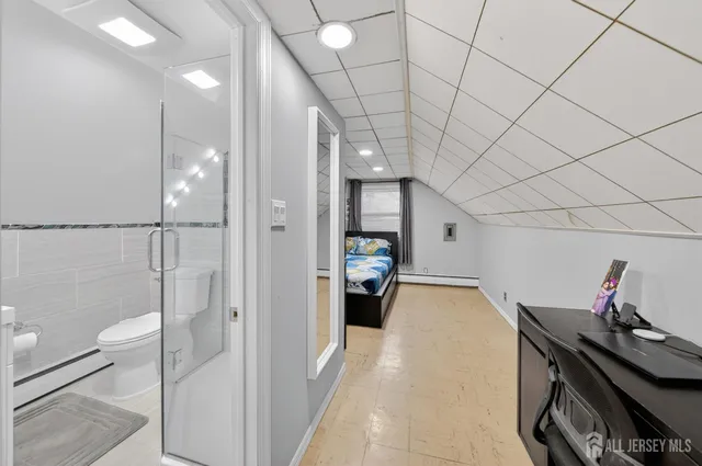 a bathroom with a toilet sink and shower