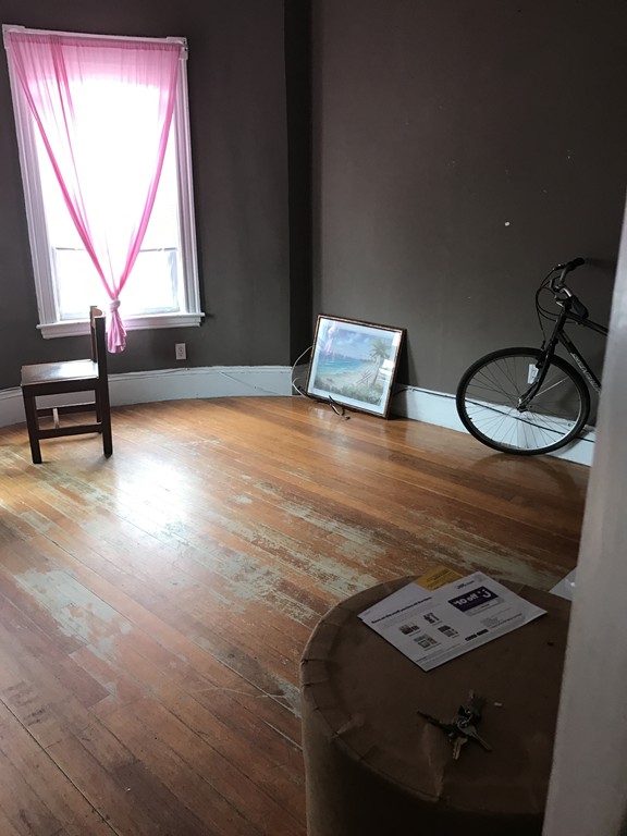 781 Columbia Road, Unit 2 Boston, MA 02125 - Photo 8 of 8 a view of room with window and wooden floor