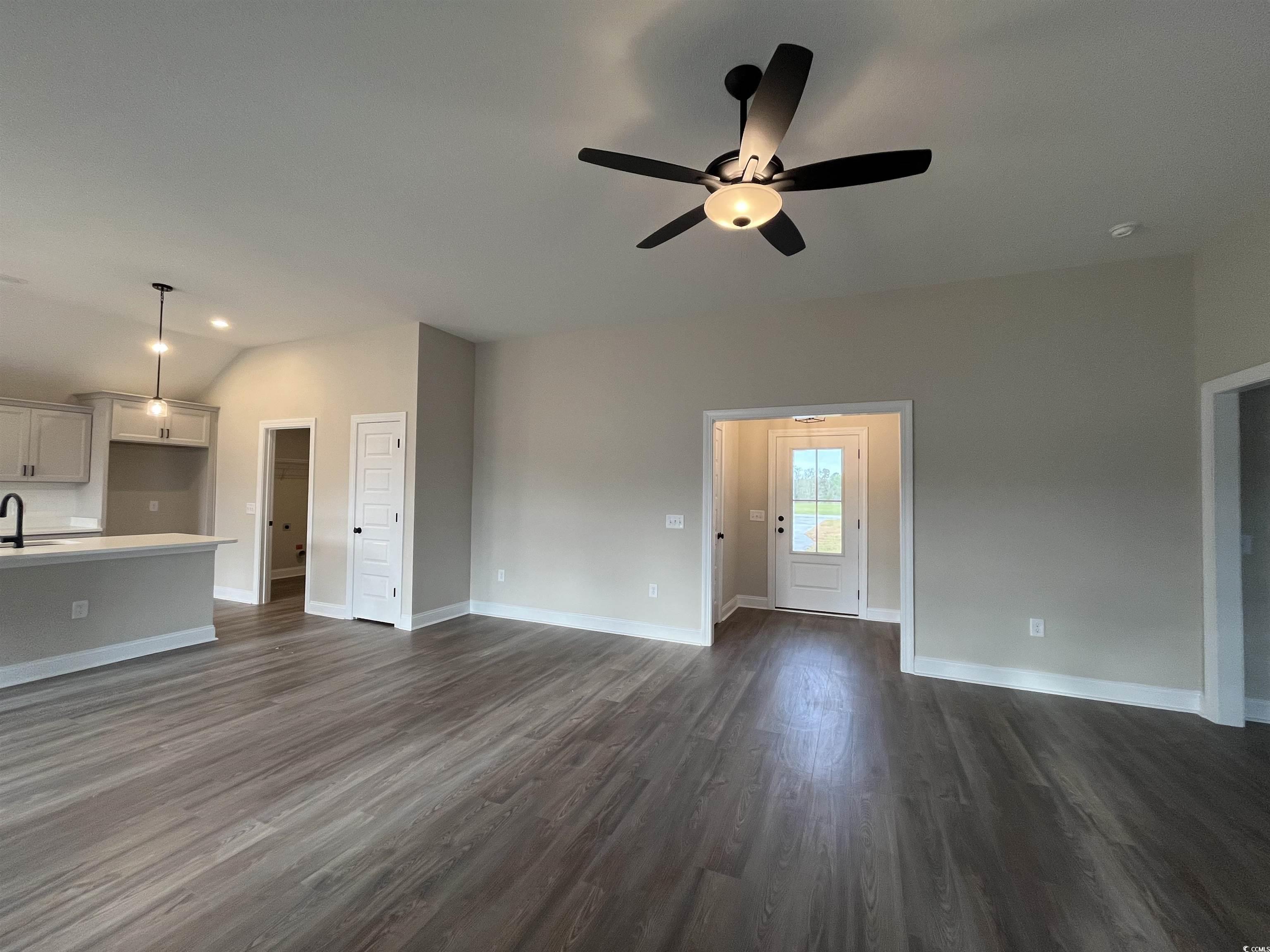 487 Highway 348 Loris, SC 29569 - Photo 4 of 17 Unfurnished living room featuring baseboards, ceil