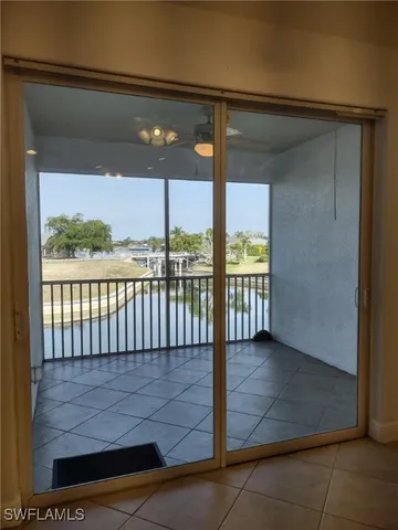 a view of staircase with railing and white walls
