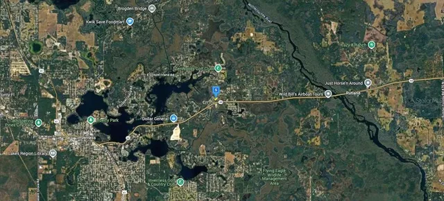 a aerial view of a house with a yard