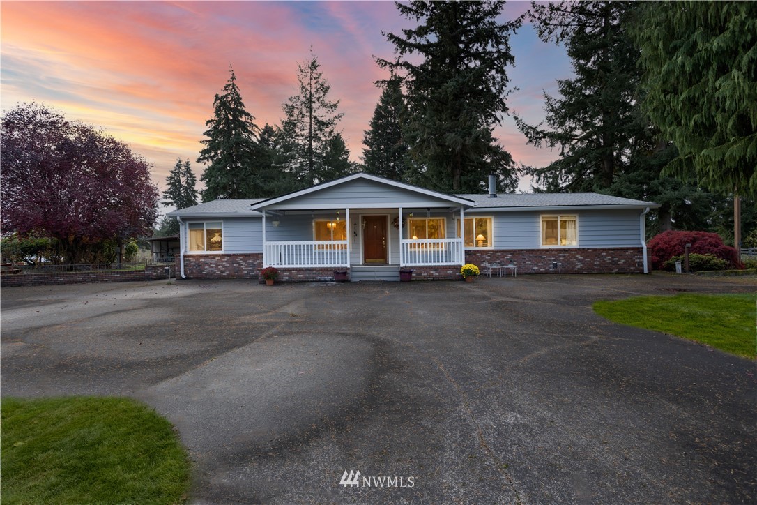18703 Joselyn Road Southwest Rochester, WA 98579 - Photo 1 of 40 a front view of a house with a garden