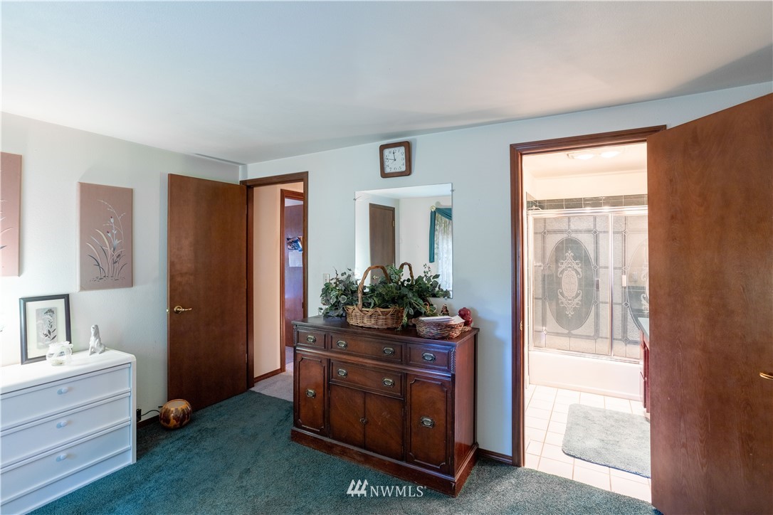 18703 Joselyn Road Southwest Rochester, WA 98579 - Photo 14 of 40 a room that has a dresser in it