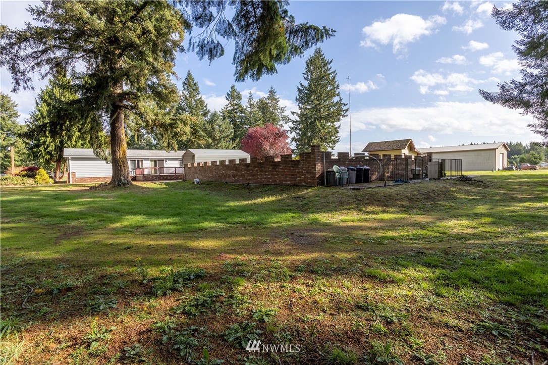 18703 Joselyn Road Southwest Rochester, WA 98579 - Photo 19 of 40 a swimming pool that has lawn chairs with a garden