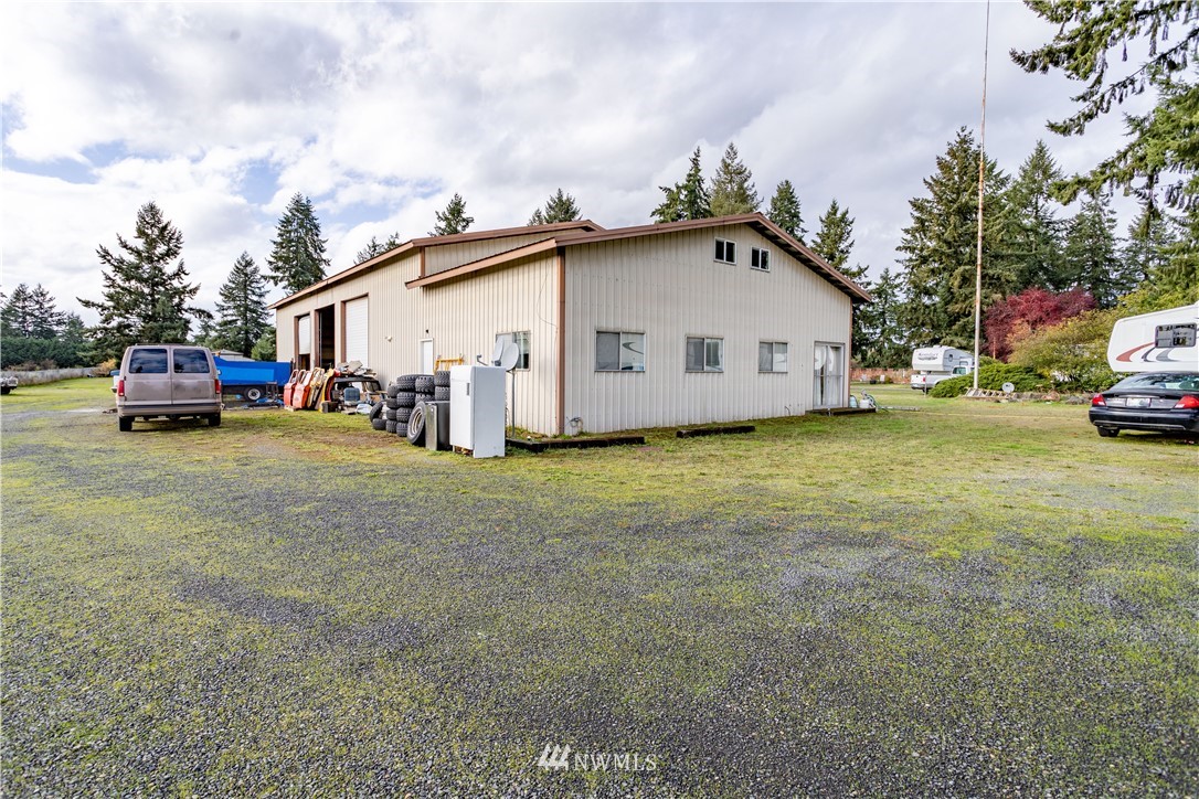 18703 Joselyn Road Southwest Rochester, WA 98579 - Photo 23 of 40 a view of a house with a back yard