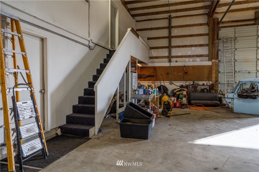 18703 Joselyn Road Southwest Rochester, WA 98579 - Photo 26 of 40 a view of a garage with a bike and white walls
