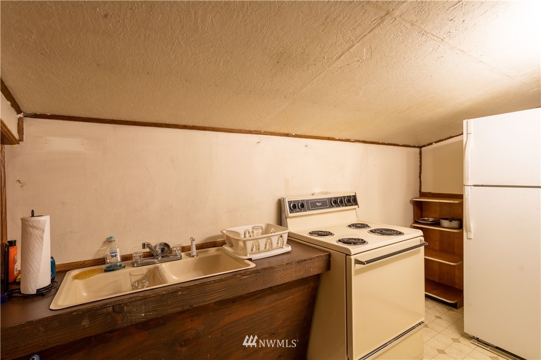18703 Joselyn Road Southwest Rochester, WA 98579 - Photo 33 of 40 a room with storage and utility