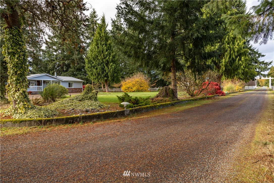 18703 Joselyn Road Southwest Rochester, WA 98579 - Photo 40 of 40 a view of a house with a yard