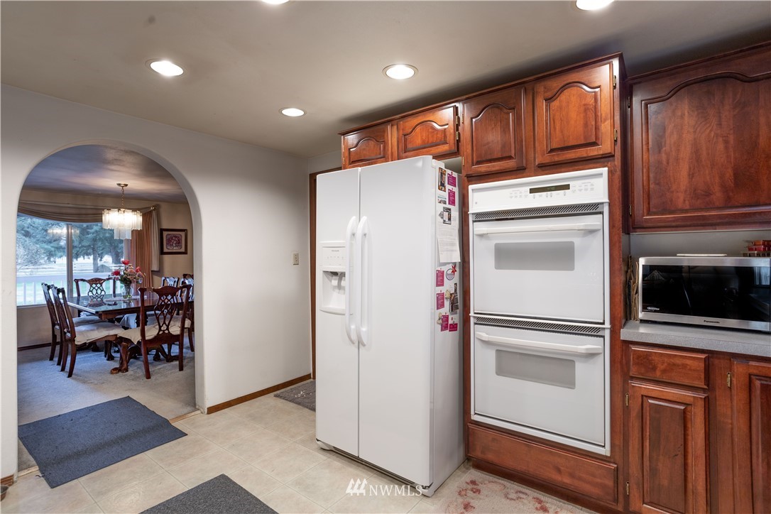 18703 Joselyn Road Southwest Rochester, WA 98579 - Photo 5 of 40 a view of kitchen with furniture and refrigerator