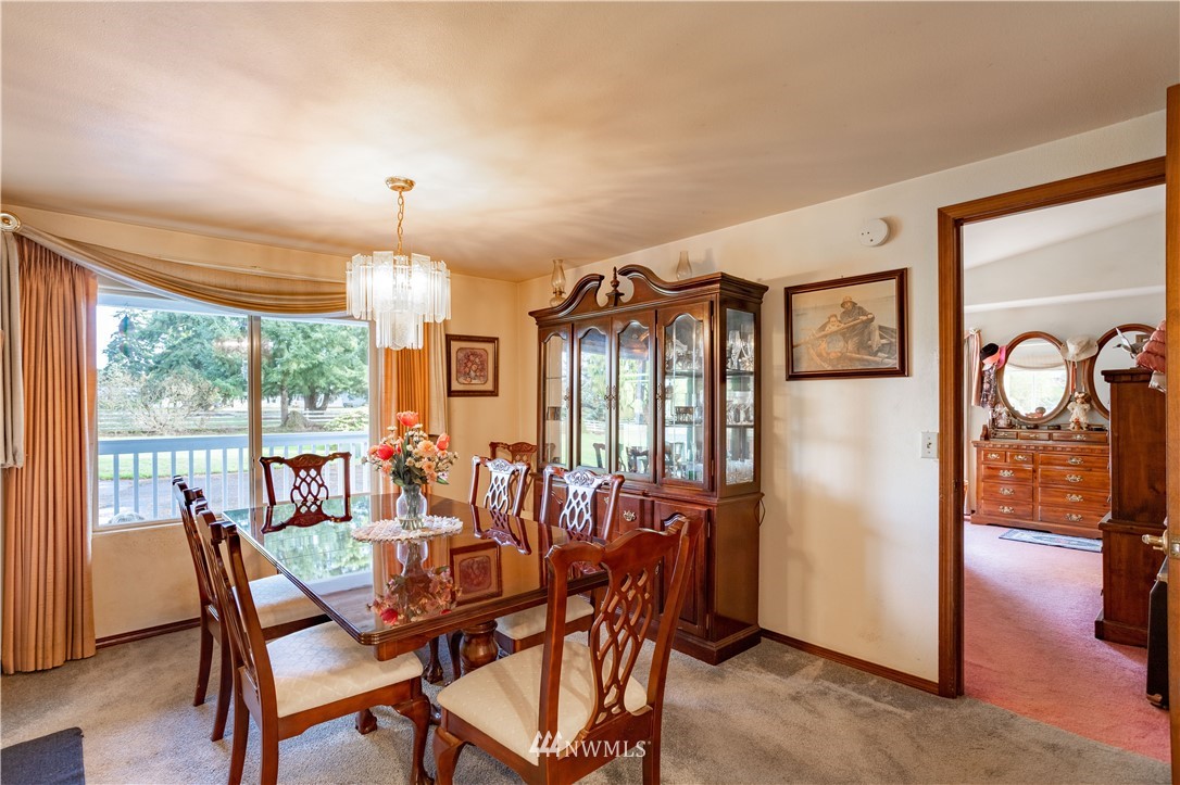 18703 Joselyn Road Southwest Rochester, WA 98579 - Photo 8 of 40 a view of a dining room with furniture window and outside view