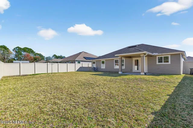 a bathroom with a sink and a yard