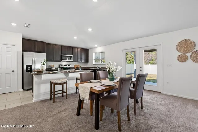 a view of a dining room with furniture