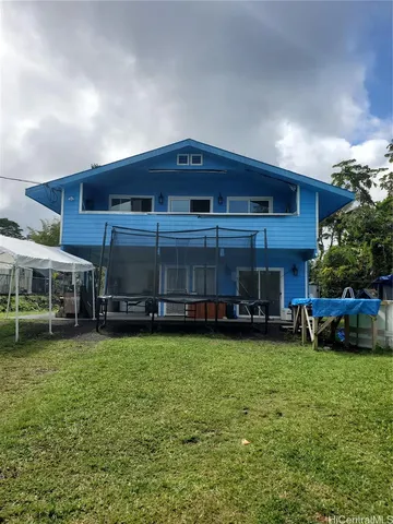 a house view with a sitting space and garden