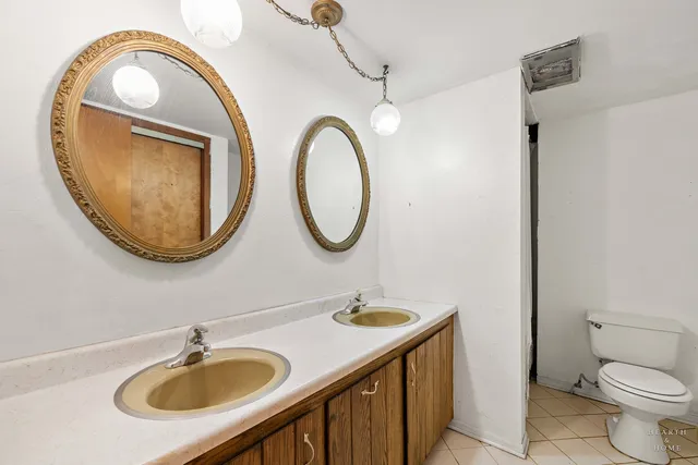 a bedroom with a bed and a bathroom