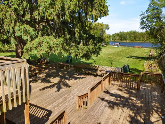 a view of a chairs and table on the patio