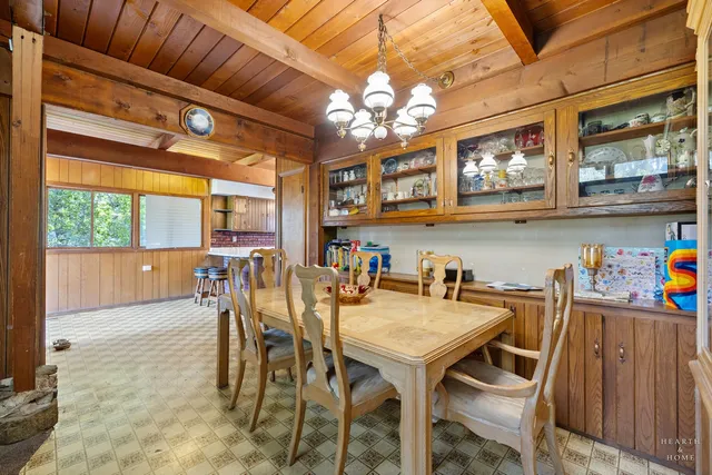 a room with chairs and window