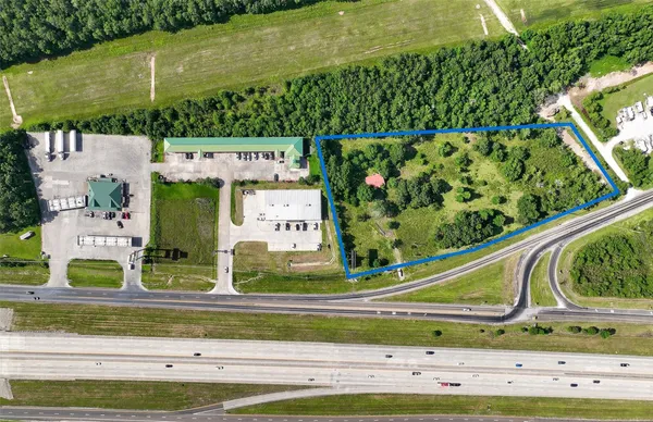 a view of swimming pool with a garden and plants