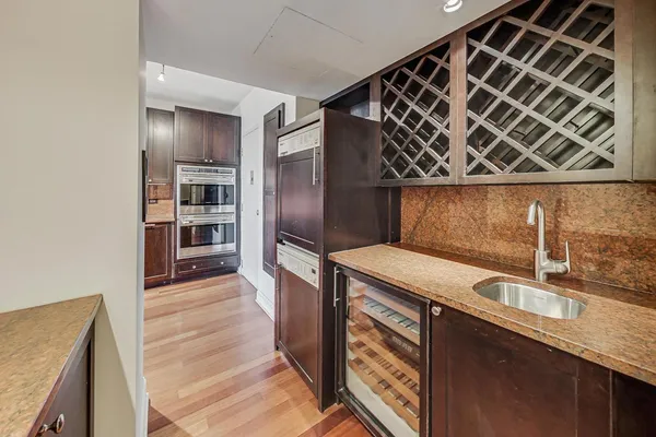 a kitchen that has a sink and a oven