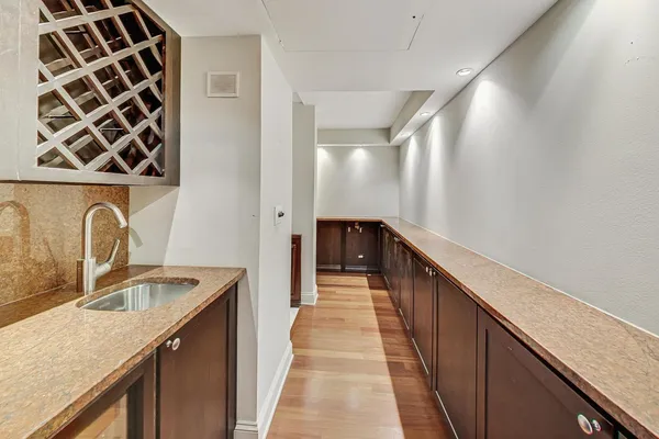 a kitchen with a sink and a refrigerator