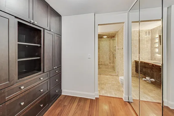 a room with wooden floor and closet