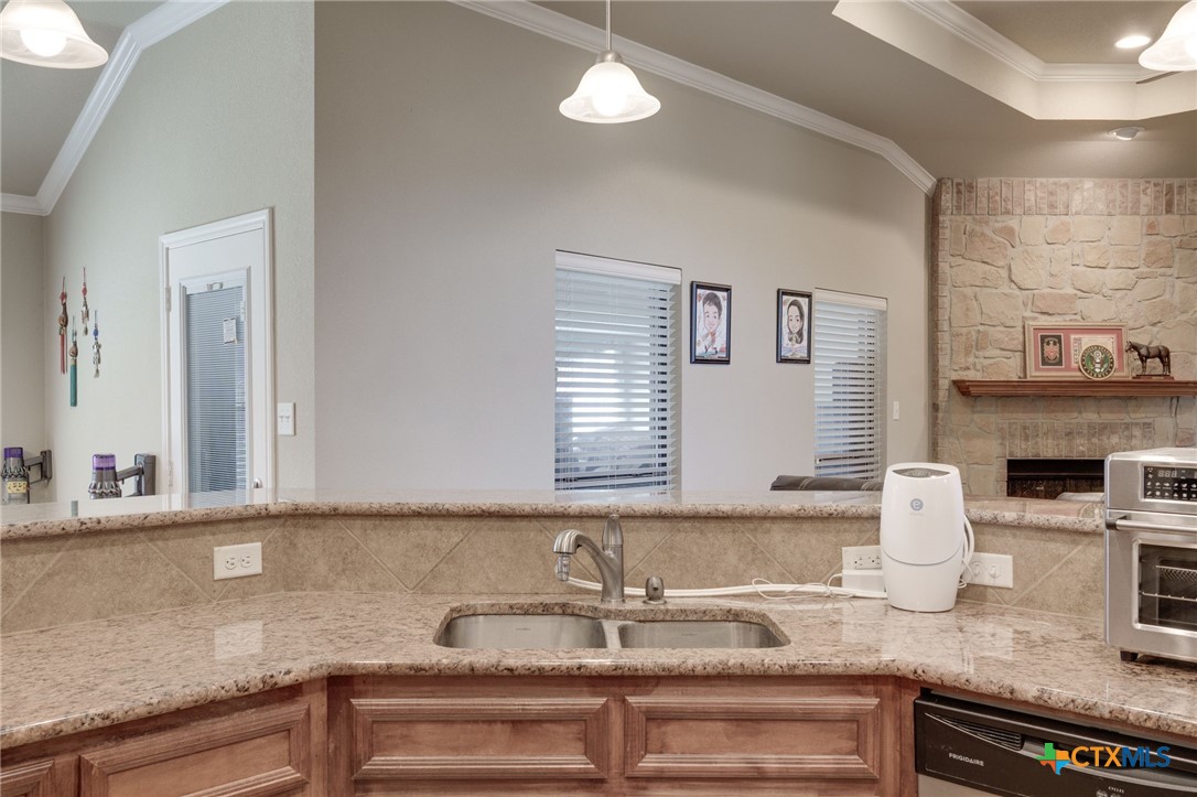 1467 County Road 4820 Kempner, TX 76539 - Photo 12 of 38 a kitchen with granite countertop a sink and a granite counter tops