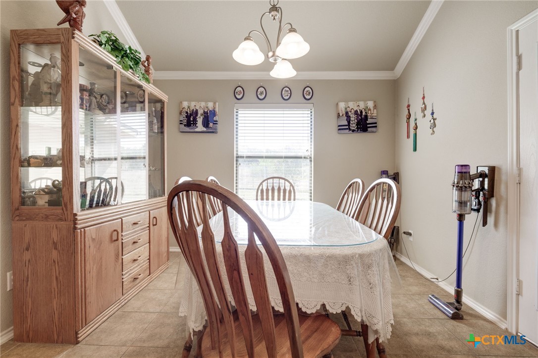 1467 County Road 4820 Kempner, TX 76539 - Photo 13 of 38 a view of a dining room with furniture and window