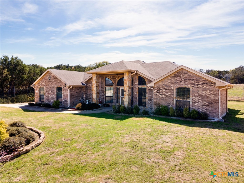 1467 County Road 4820 Kempner, TX 76539 - Photo 2 of 38 a front view of a house with yard and garage