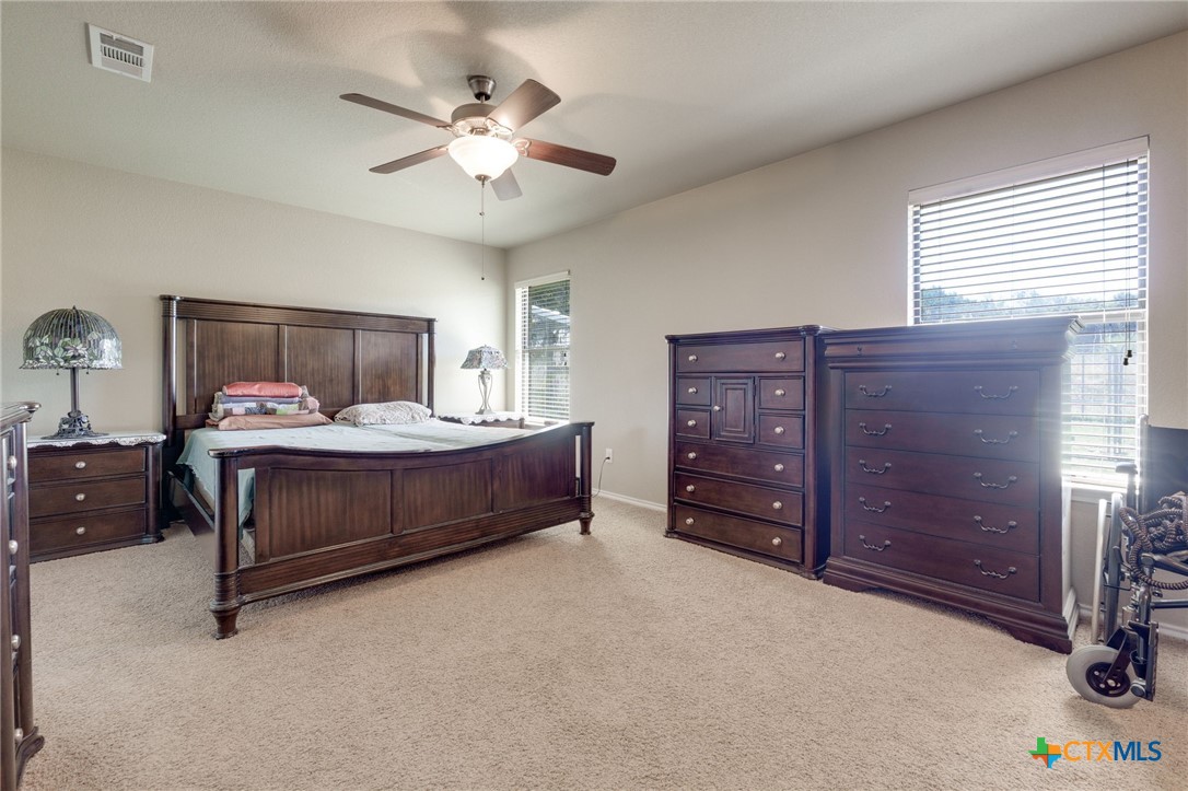 1467 County Road 4820 Kempner, TX 76539 - Photo 25 of 38 a bedroom with a bed and a dresser