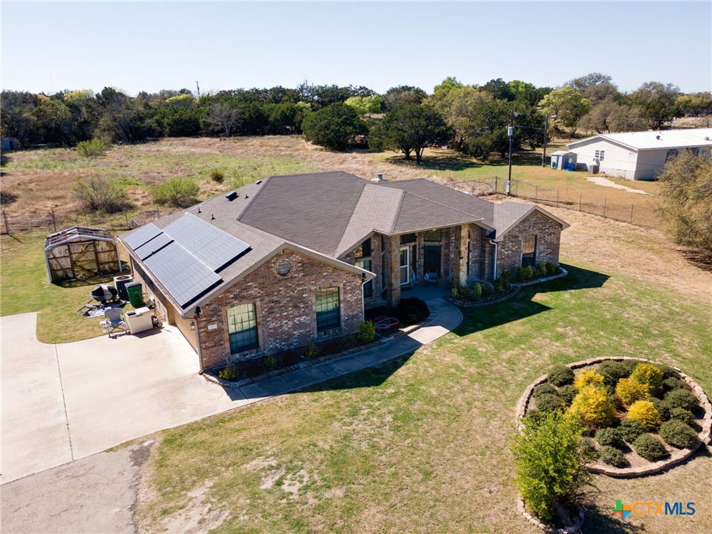 1467 County Road 4820 Kempner, TX 76539 - Photo 4 of 38 a view of a swimming pool with a patio