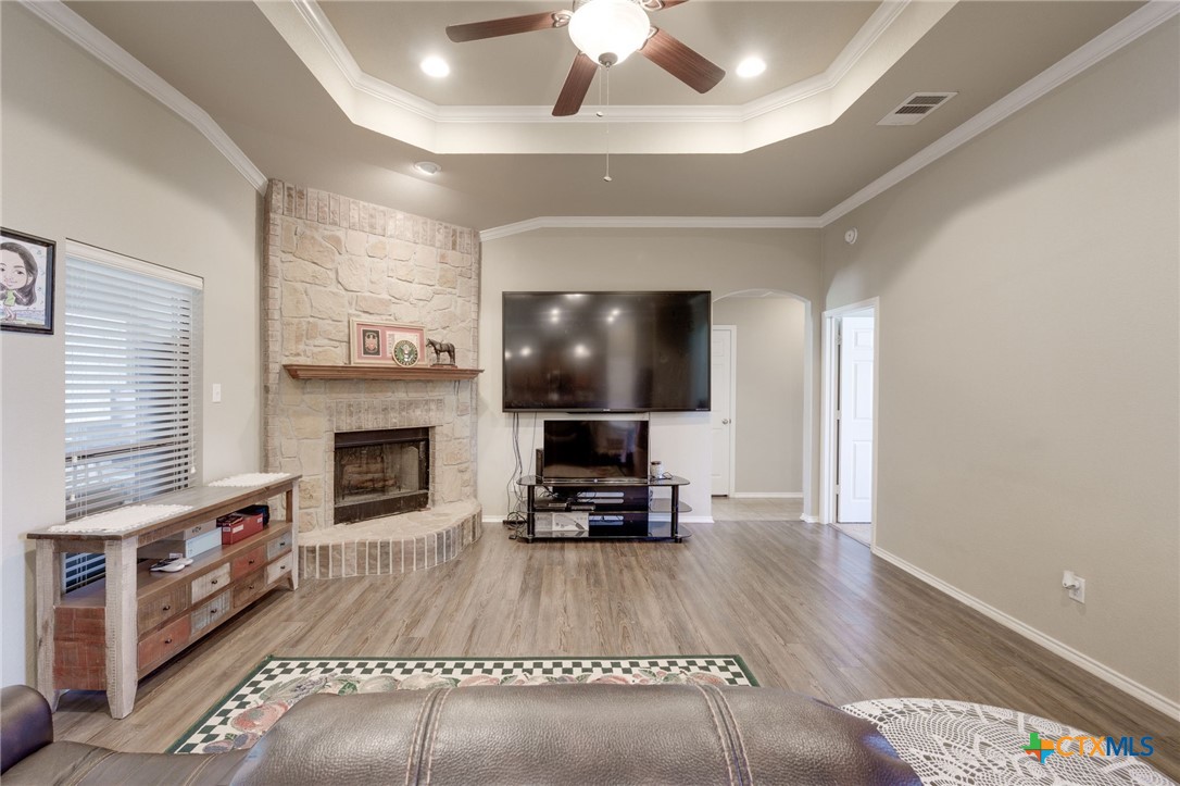 1467 County Road 4820 Kempner, TX 76539 - Photo 7 of 38 a living room with furniture and a fireplace