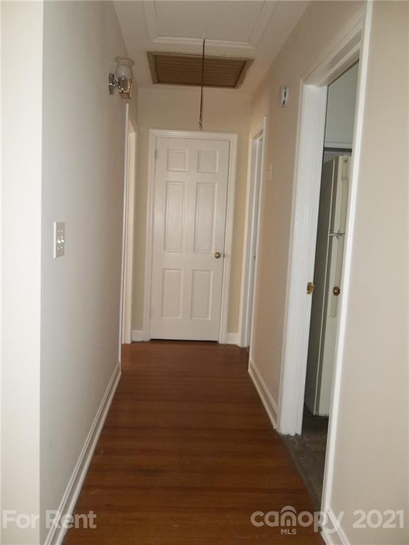 4227 Walker Road, Unit 6 Charlotte, NC 28211 - Photo 7 of 7 a view of a hallway with wooden floor