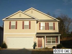 2213 Gooseberry Road Charlotte, NC 28208 - Photo 1 of 8 a view of a white house with large windows