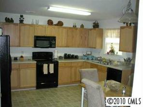 2213 Gooseberry Road Charlotte, NC 28208 - Photo 4 of 8 a kitchen with a sink and a stove top oven