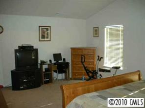2213 Gooseberry Road Charlotte, NC 28208 - Photo 6 of 8 a room with furniture and a window