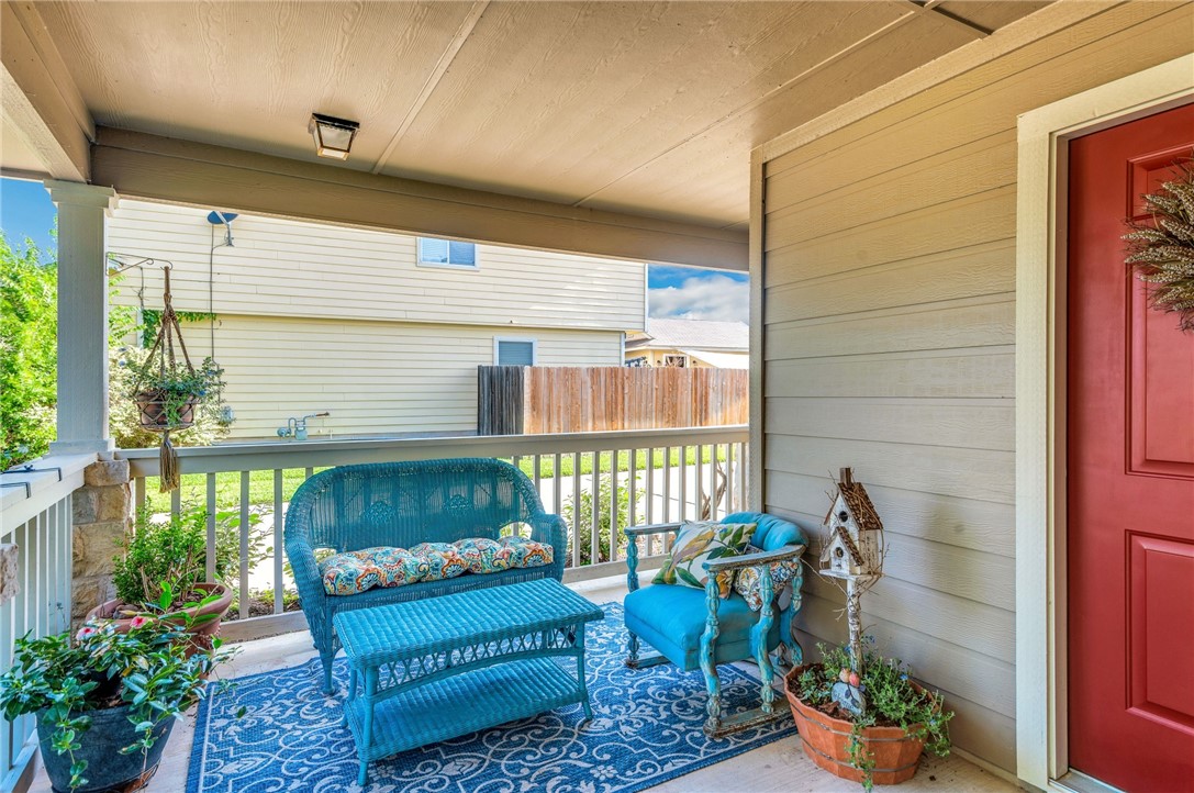 a outdoor living space with furniture and a potted plant