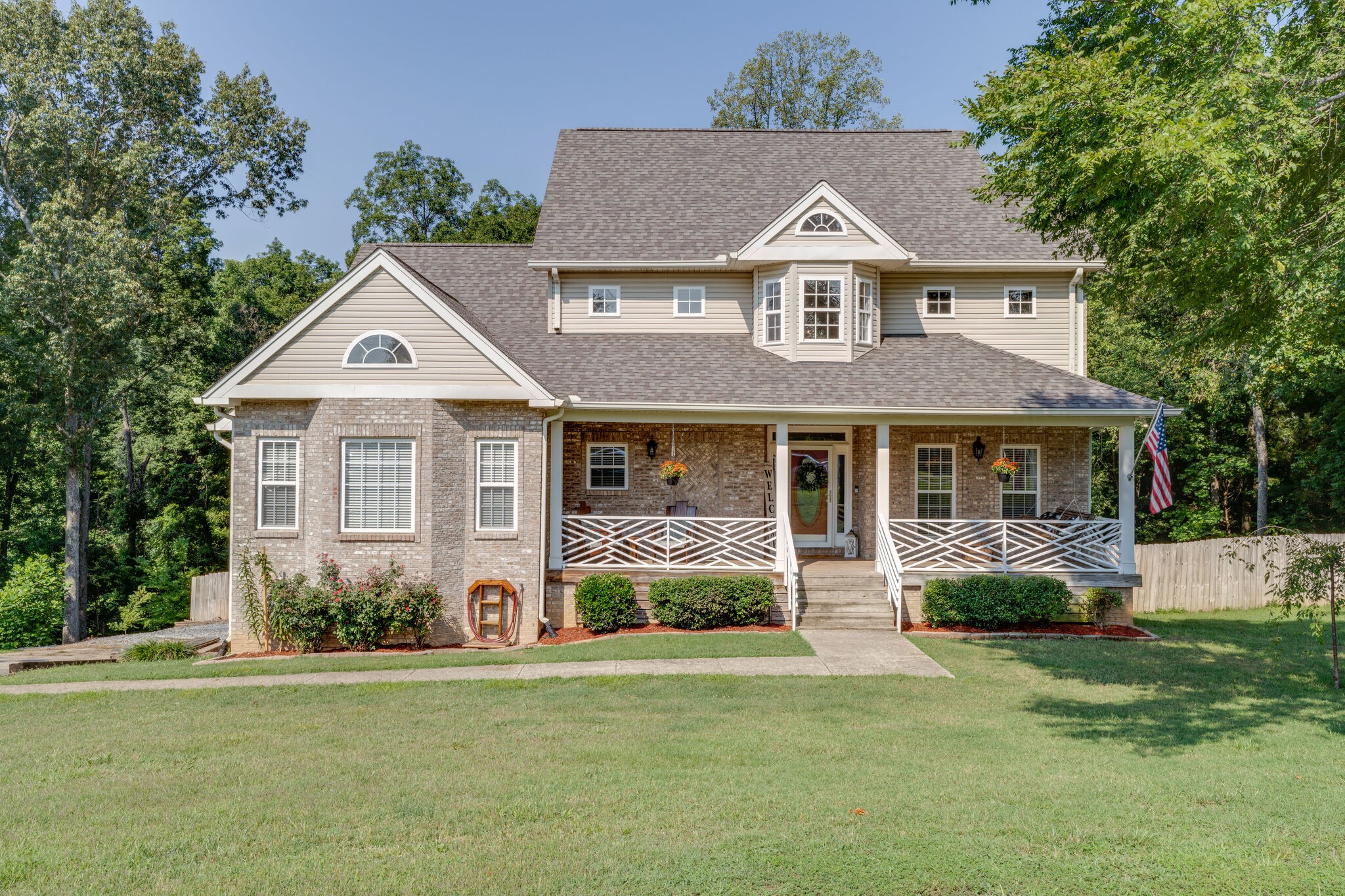 a front view of a house with a yard