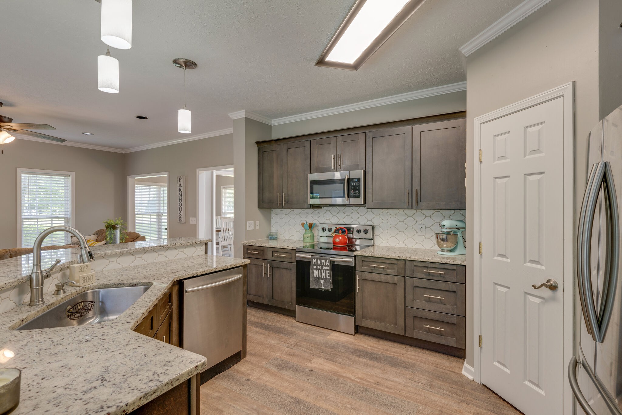 2754 Gideon Road Greenbrier, TN 37073 - Photo 11 of 45 a kitchen with stainless steel appliances granite countertop a sink stove and refrigerator