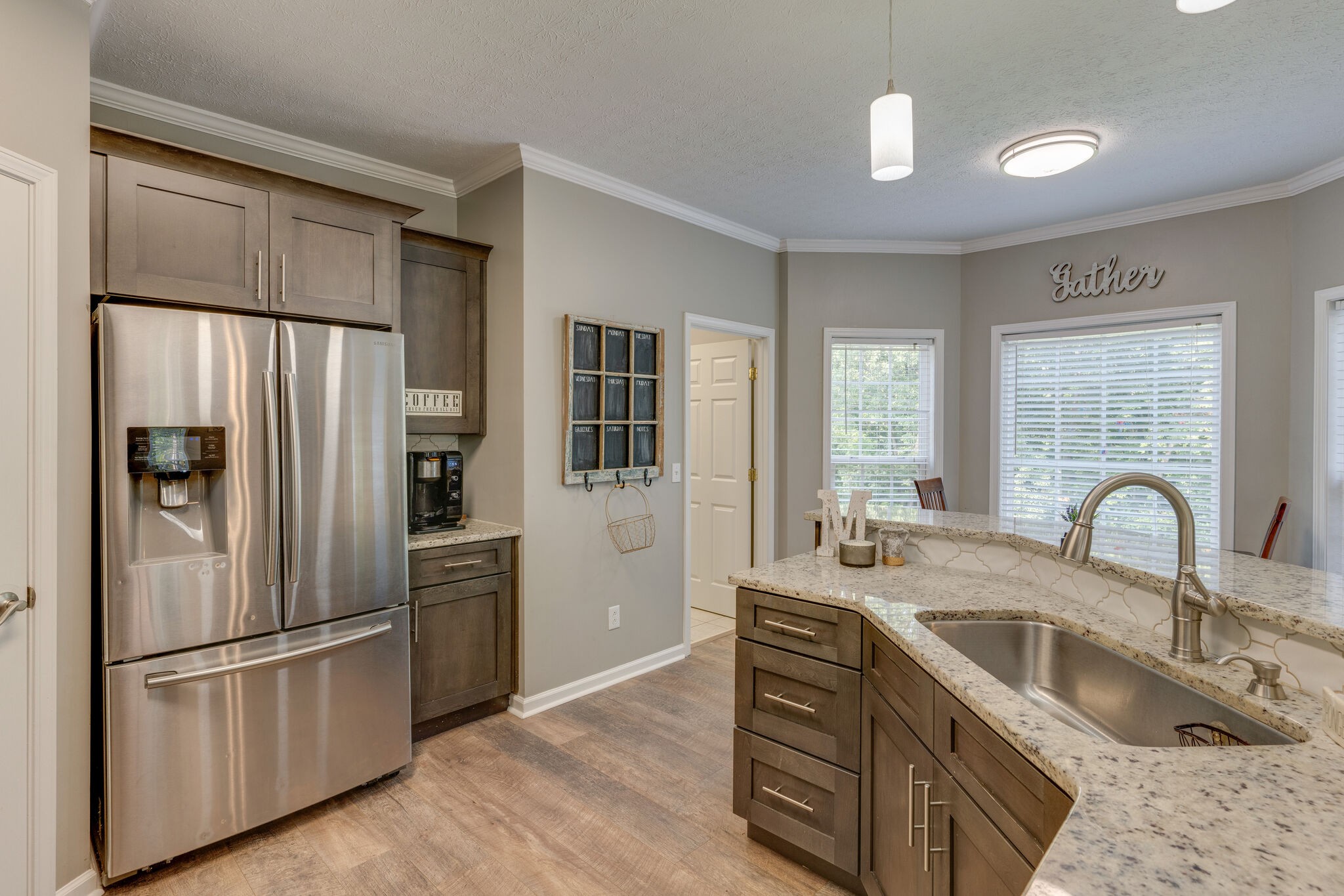 2754 Gideon Road Greenbrier, TN 37073 - Photo 13 of 45 a kitchen with stainless steel appliances granite countertop a refrigerator a sink a stove and island