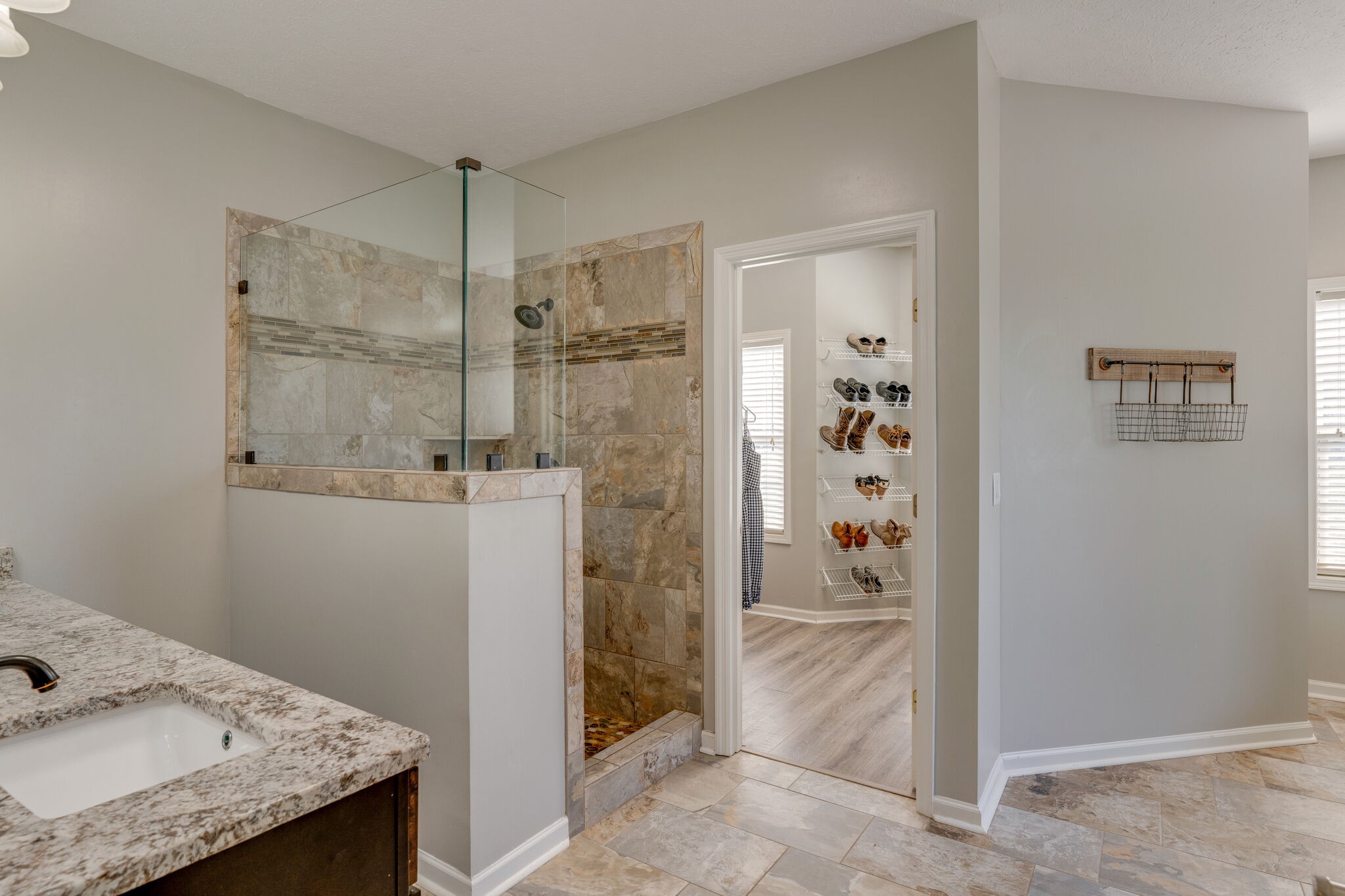 2754 Gideon Road Greenbrier, TN 37073 - Photo 18 of 45 a bathroom with a granite countertop sink a shower and a mirror