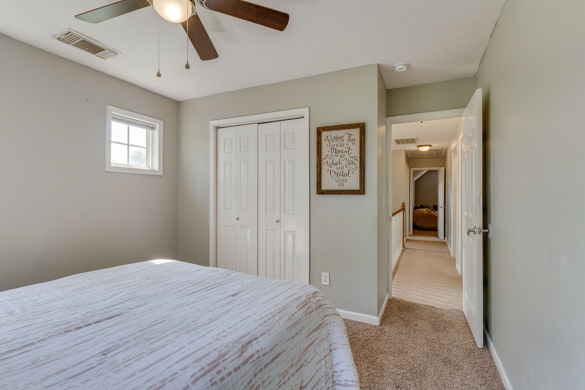 2754 Gideon Road Greenbrier, TN 37073 - Photo 26 of 45 a bedroom with a bed and a chandelier fan