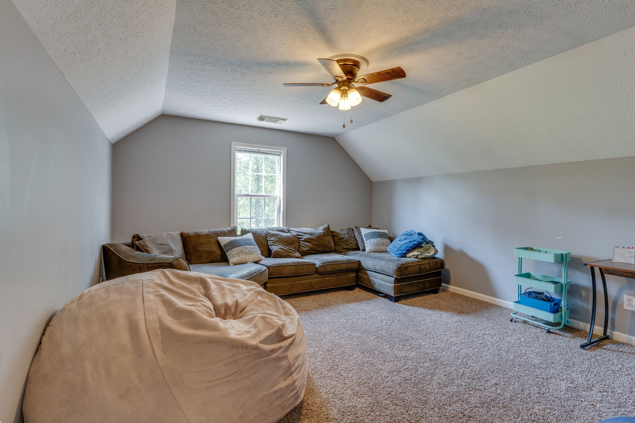 2754 Gideon Road Greenbrier, TN 37073 - Photo 33 of 45 a living room with furniture and a chandelier