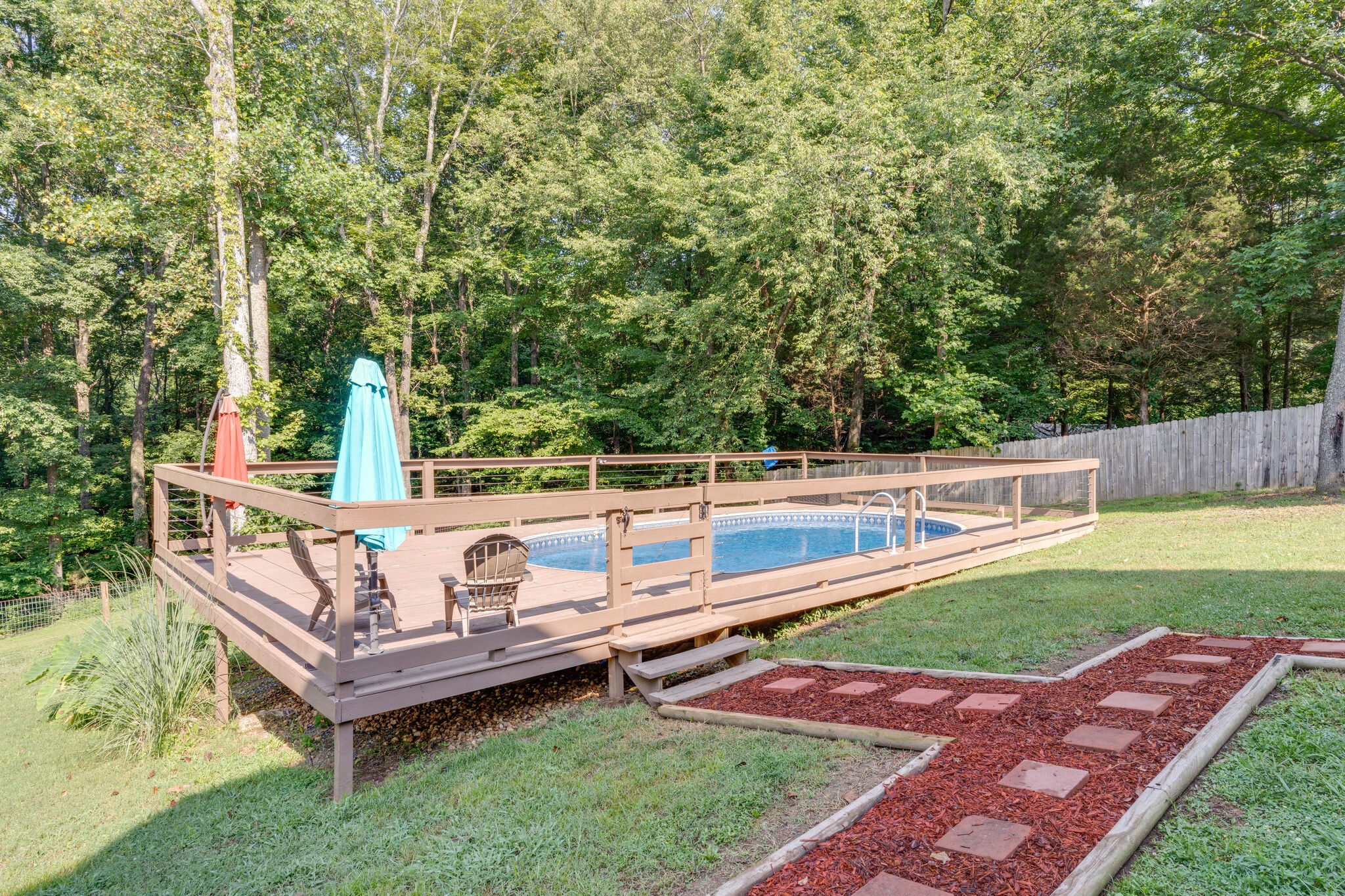 2754 Gideon Road Greenbrier, TN 37073 - Photo 40 of 45 a view of a wooden deck with chairs and a yard